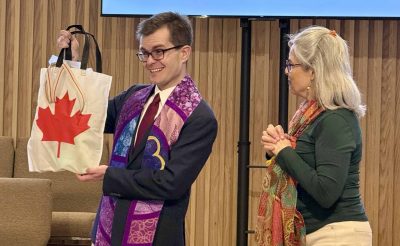 Rev Alex accepts the gifts from Beth Ann (co-chair of the Ministerial Search Committee)