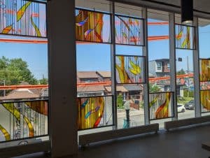 Stained glass panels in the Community Hall <br> overlooking Oakwood Ave.