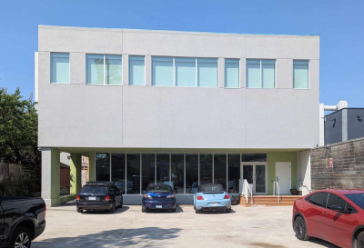 Back of 473. The Sanctuary is on the second floor. The blinds are closed. The East Hall is on the ground floor. Note that parking will be limited to staff and those with mobility challenges.