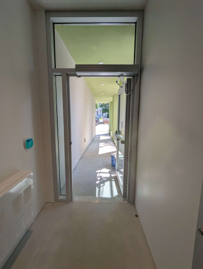 The outside door on the South side of the ground floor. You can see houses on Robina Ave in the background. The outside door on the South side of the ground floor. You can see houses on Robina Ave in the background.