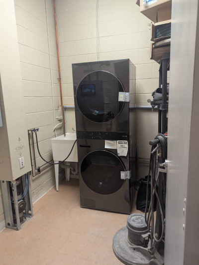 Laundry machines in the utility closet