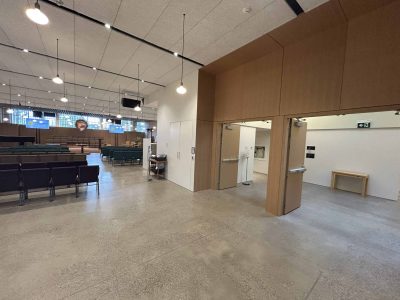 At the back of the Sanctuary; Elevator is on the far wall (hidden by wooden doors)