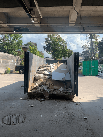 Dumpster in our parking lot on Robina Ave