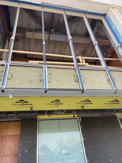 Looking from the street onto the windows on the second floor - ready for glazing