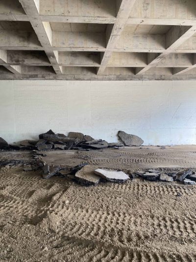 Removing asphalt for foundations at the back of the first floor